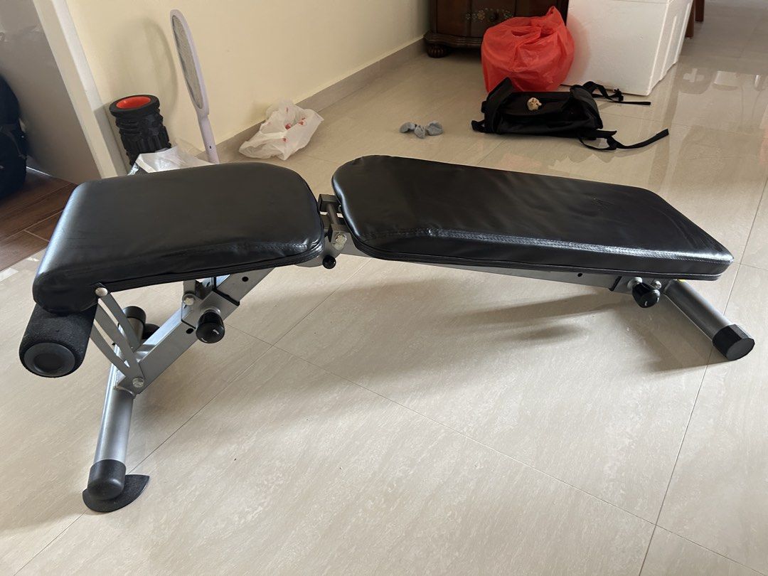 Adjustable Bench solid build (Category: Weights & Dumbbells) located in Singapore. Submitted by pasirrismonkey (Listing ID 1465999501, Image 2). Description: Adjustable workout bench. Multiple incline and flat settings. Foam leg rollers at the front for secure workouts during sit-ups and bench presses. Sturdy metal build with adjustable knobs on the support bars. Easy to fold or adjust angles for home gym routines. Self collection .