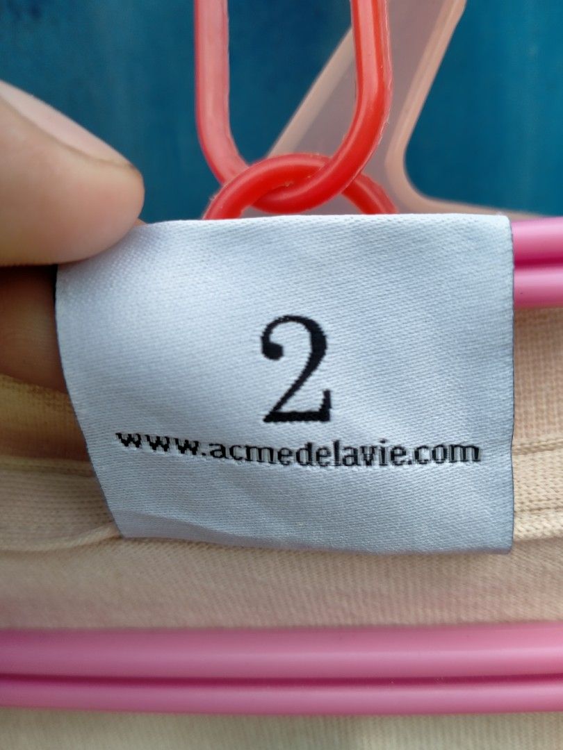 ADLV Teddy Bear T-Shirt Size 2 Beige (Category: Shirts) located in Davao. Submitted by ervinpolino09 (Listing ID 1465972175, Image 3). Description: - Brand: Acme de la vie (ADLV) - Color: Beige - Size: Size 2 Dimension width 23 length 29 Good condition - Material: Soft cotton - Design: Cute teddy bear graphic with text on the chest - Condition: Clean collar and immaculate print .