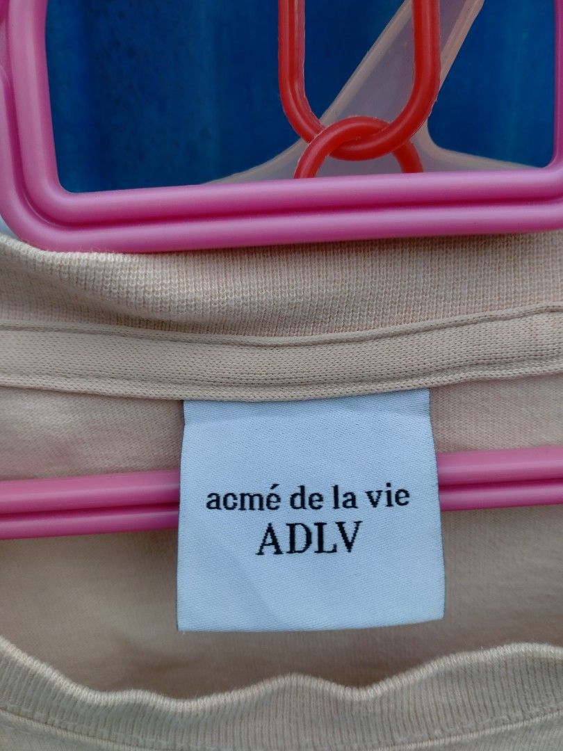 ADLV Teddy Bear T-Shirt Size 2 Beige (Category: Shirts) located in Davao. Submitted by ervinpolino09 (Listing ID 1465972175, Image 2). Description: - Brand: Acme de la vie (ADLV) - Color: Beige - Size: Size 2 Dimension width 23 length 29 Good condition - Material: Soft cotton - Design: Cute teddy bear graphic with text on the chest - Condition: Clean collar and immaculate print .