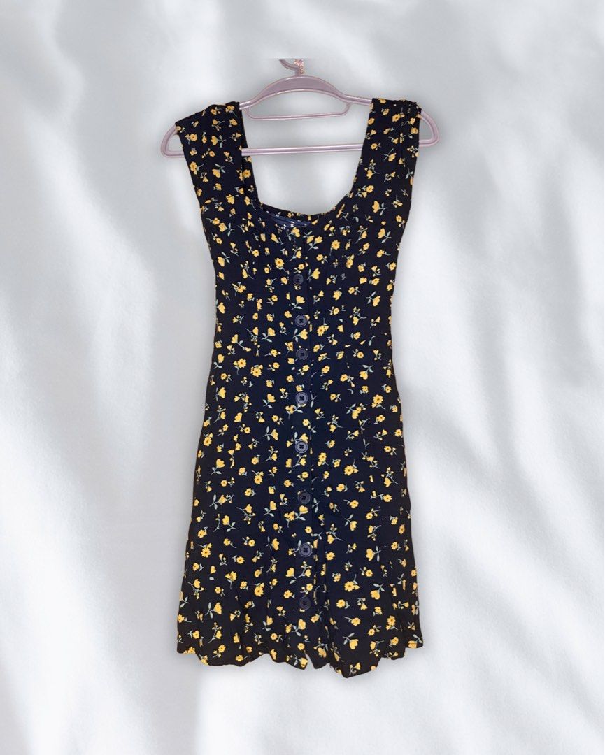 Aeropostale Striped Tie-Front Romper (Category: Dresses) located in Roxas City. Submitted by mariellaann_ (Listing ID 1466001091, Image 1). Description: • Bought in the US 🇺🇸 • Black mini dress with tiny yellow flowers • Square neckline with thick straps • Fitted bodice with a slightly flared hem • Front button detail • Cute & flattering fit • Perfect for casual days, dates, or summer outfits 🌻.