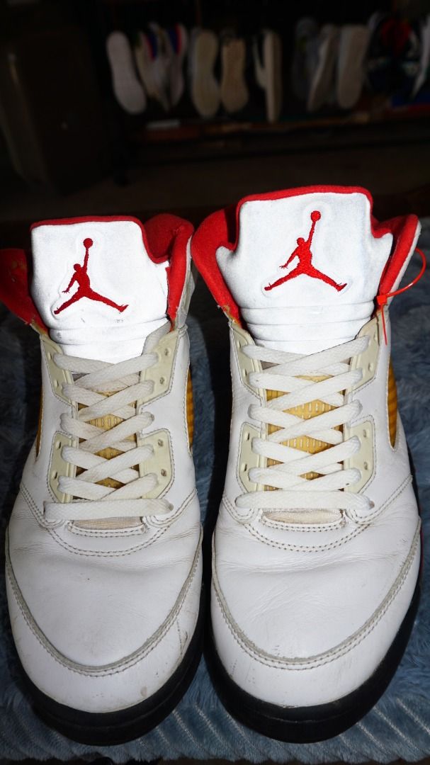 Air Jordan 5 Retro Fire Red Size US 10 (Category: Sneakers) located in Lucena. Submitted by erikj27 (Listing ID 1466042360, Image 2). Description: No box from Thrift Store (ukay-ukay) - Model: Air Jordan 5 Retro Fire Red - Size: US 10 / UK 9 / EUR 44 - Design: White leather upper, reflective silver tongue, red lining, and authentic Nike Air heel branding - Condition: Signs of wear include yellowed netting and soles from age, plus minor scuffs on 