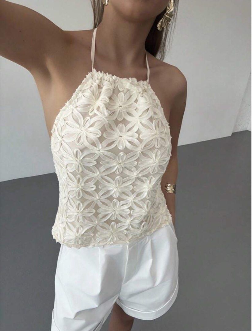 Aloruh Women's Solid Color Halter Neck Backless Top (Category: Sleeveless) located in Manila. Submitted by jehielash (Listing ID 1466096068, Image 1). Description: - Brand/Model: Aloruh white halter neck top - Size: Small - Design: Backless with adjustable thin tie-back straps - Detail: All-over floral cutout lace pattern on the front - Perfect for: Summer days out, beach trips, or casual dates - Condition: Excellent.