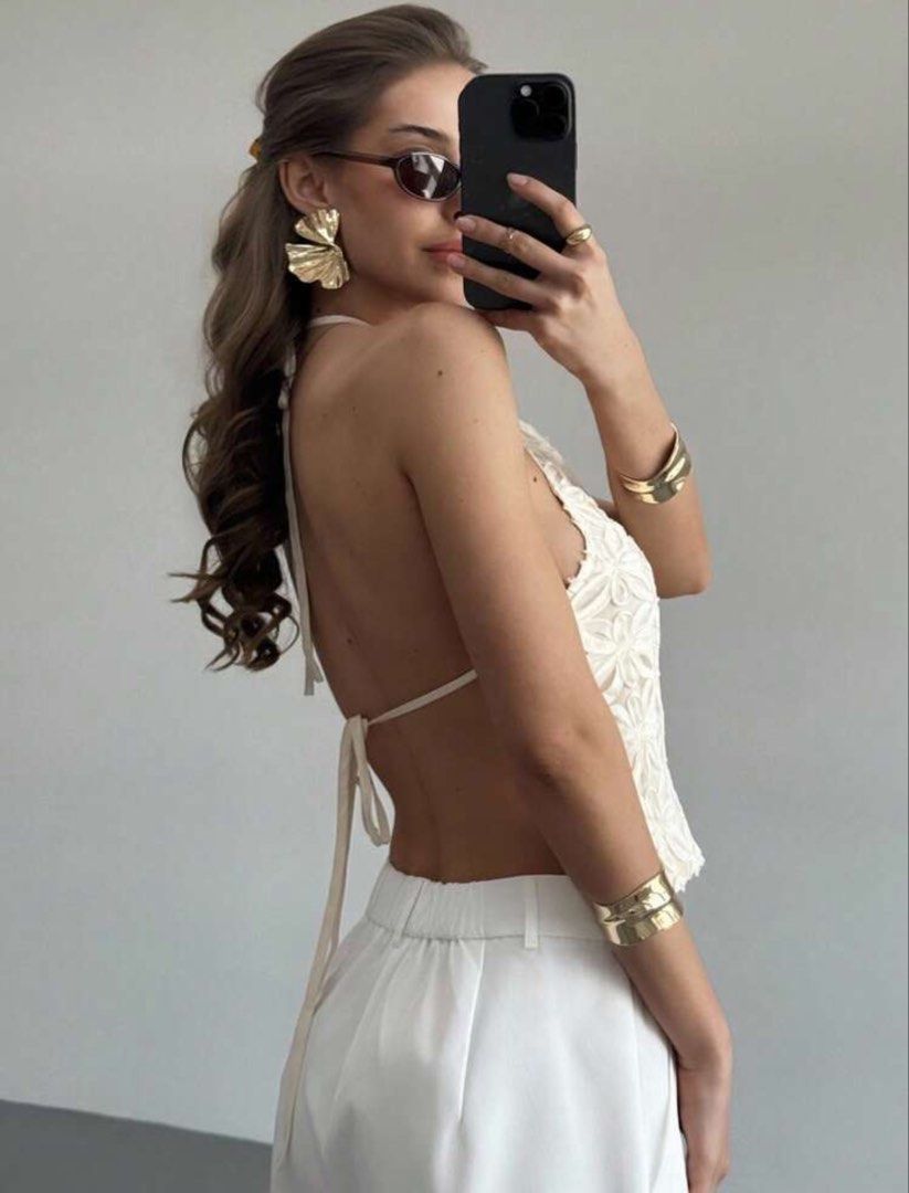 Aloruh Women's Solid Color Halter Neck Backless Top (Category: Sleeveless) located in Manila. Submitted by jehielash (Listing ID 1466096068, Image 3). Description: - Brand/Model: Aloruh white halter neck top - Size: Small - Design: Backless with adjustable thin tie-back straps - Detail: All-over floral cutout lace pattern on the front - Perfect for: Summer days out, beach trips, or casual dates - Condition: Excellent.