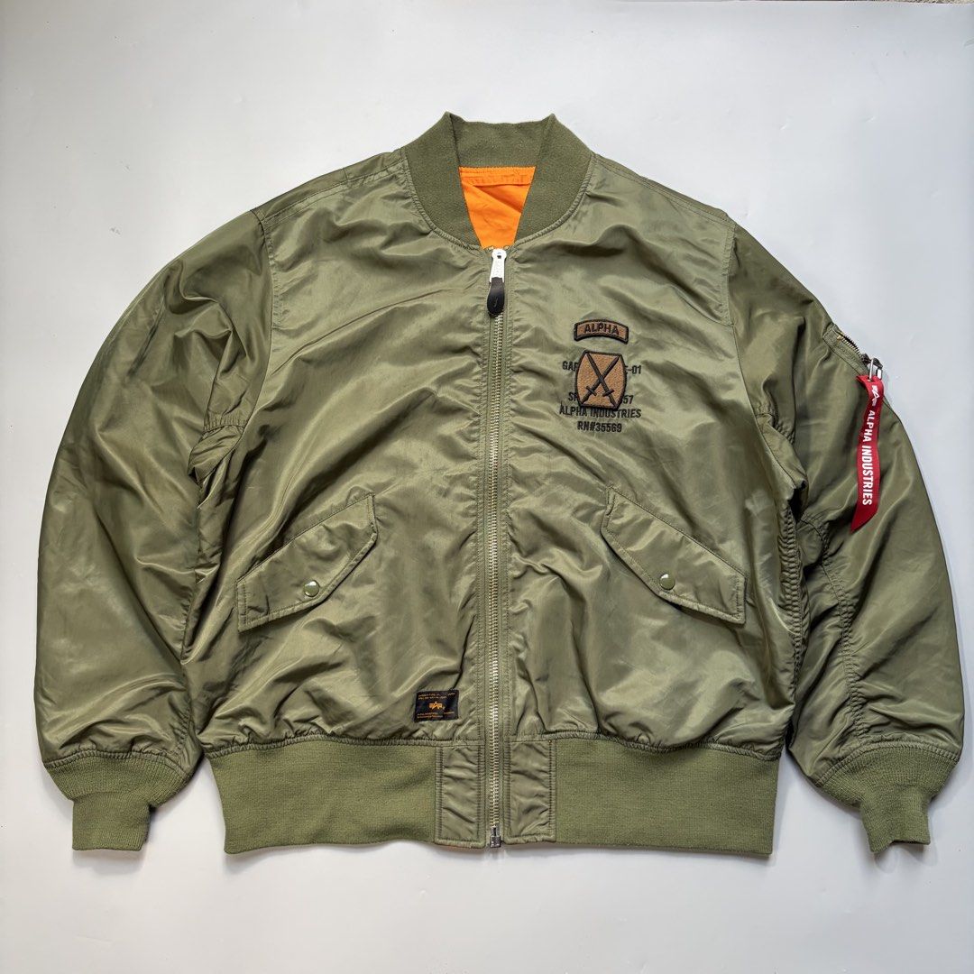 ALPHA INDUSTRIES Embroidered logo on a bomber jacket (Category: Coats, Jackets and Outerwear) located in Magalang. Submitted by luxgood18 (Listing ID 1465977231, Image 1). Description: ALPHA INDUSTRIES Embroidered logo on a bomber jacket Excellent condition Size XL • Zipper closure • Decorative pocket • Tonal stitching Fabric: Shell 100% nylon; Lining 100% nylon; Trimming 98.7% polyester; 1.3% spandex 2k plus shipping fee.