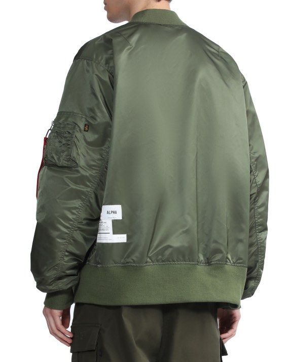 ALPHA INDUSTRIES Embroidered logo on a bomber jacket (Category: Coats, Jackets and Outerwear) located in Magalang. Submitted by luxgood18 (Listing ID 1465977231, Image 3). Description: ALPHA INDUSTRIES Embroidered logo on a bomber jacket Excellent condition Size XL • Zipper closure • Decorative pocket • Tonal stitching Fabric: Shell 100% nylon; Lining 100% nylon; Trimming 98.7% polyester; 1.3% spandex 2k plus shipping fee.