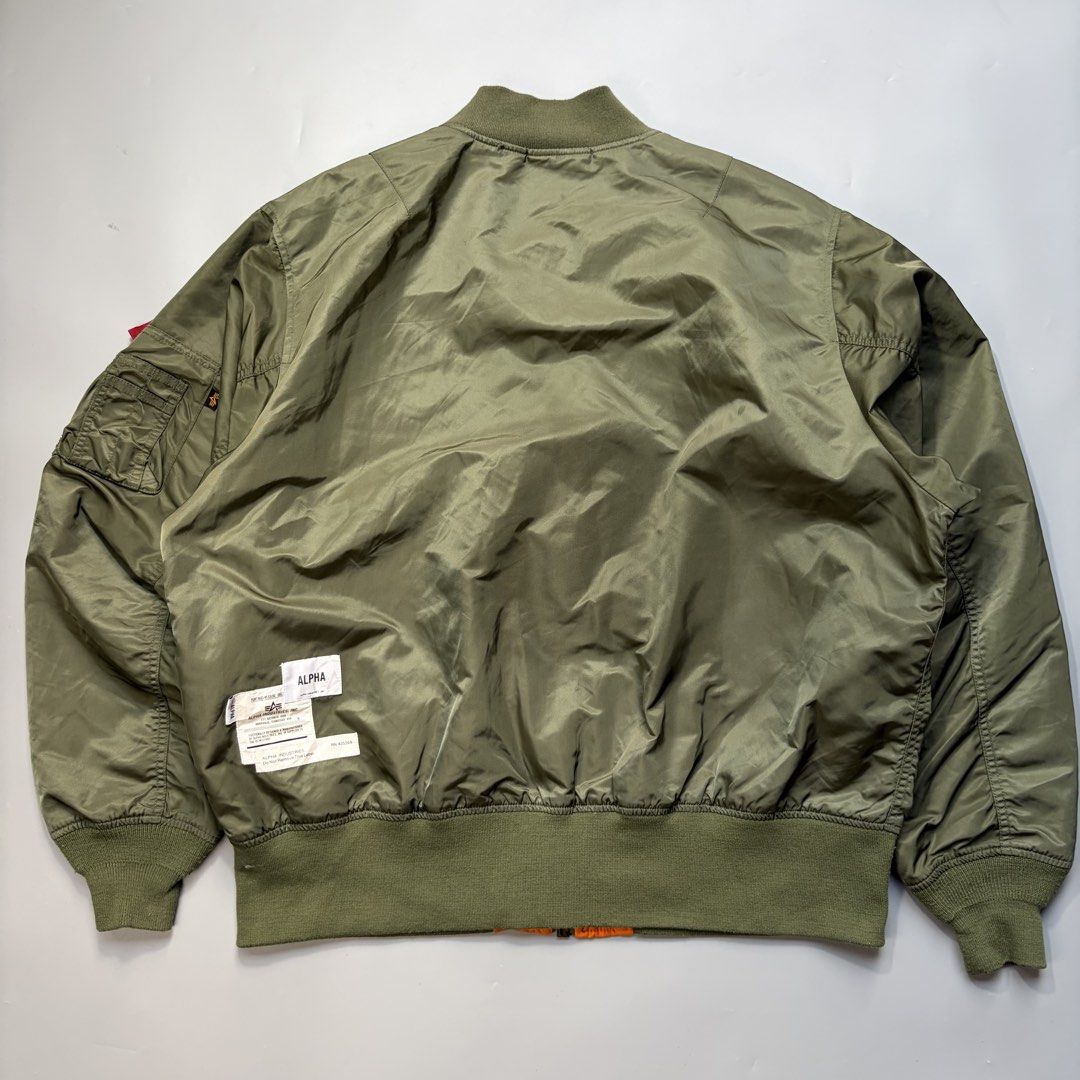 ALPHA INDUSTRIES Embroidered logo on a bomber jacket (Category: Coats, Jackets and Outerwear) located in Magalang. Submitted by luxgood18 (Listing ID 1465977231, Image 2). Description: ALPHA INDUSTRIES Embroidered logo on a bomber jacket Excellent condition Size XL • Zipper closure • Decorative pocket • Tonal stitching Fabric: Shell 100% nylon; Lining 100% nylon; Trimming 98.7% polyester; 1.3% spandex 2k plus shipping fee.