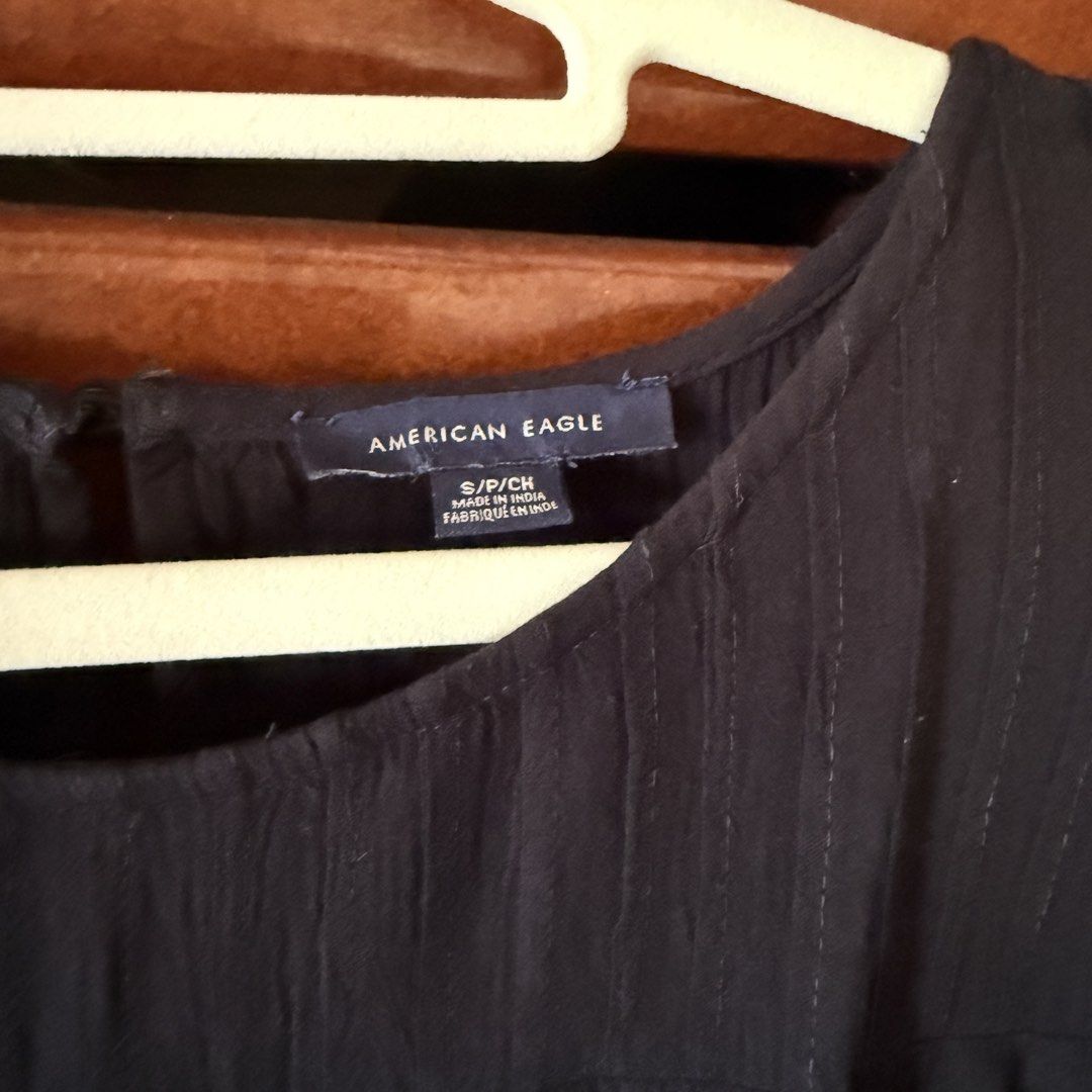 American Eagle Black Blouse Size S (Category: Longsleeves) located in Davao. Submitted by keirousel (Listing ID 1466034122, Image 2). Description: - Brand: American Eagle - Size: S - Color: Black with white and beige embroidery - Style: Round neck, pleated front panel, wide bell sleeves - Material: Lightweight and comfortable - Condition: Excellent pre-loved condition - Perfect for both casual days and evening wear.