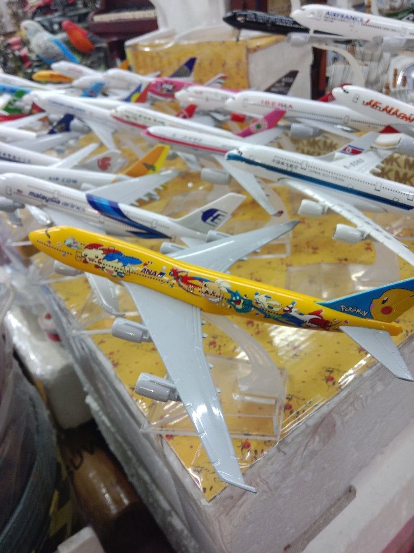 ANA Pokemon Pikachu Jet Model Airplane (Category: Vehicle & Diecast Models) located in Manila. Submitted by iliasjen3082126 (Listing ID 1465967514, Image 1). Description: - Eye-catching bright yellow ANA Boeing model - Features colourful Pokemon and Pikachu graphics along the fuselage - Detailed wings and engines attached - Includes a clear plastic display stand - Great collectible piece for aviation enthusiasts and anime fans.