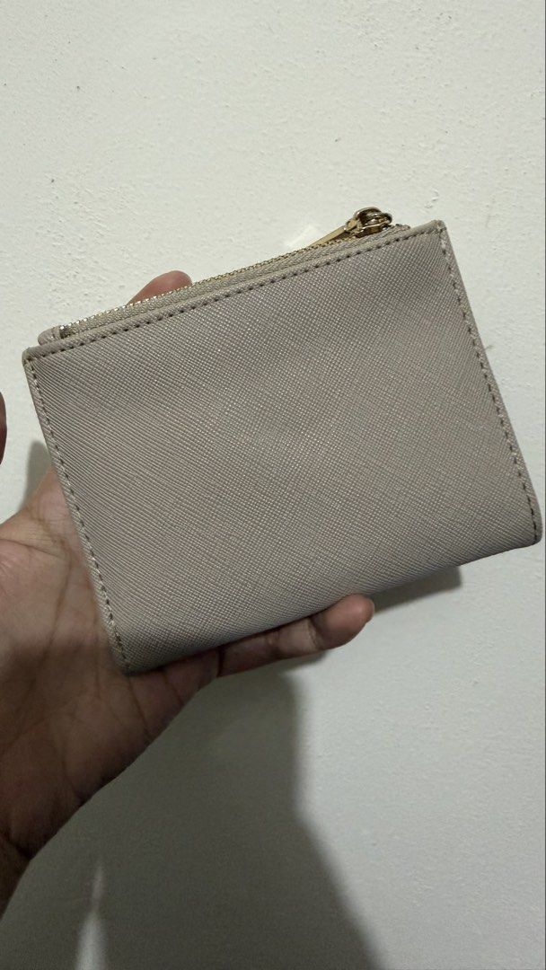 Anne Klein Small Bi-Fold Wallet in Stone (Category: Wallets & Card holders) located in Rizal. Submitted by lovegclothingph (Listing ID 1466094486, Image 3). Description: - Brand: Anne Klein (Model AKW1198) - Condition: Looks new with original store tag - Color: Elegant stone - Material: Textured finish with gold-tone hardware - Features: Bi-fold design with a convenient top zipper coin compartment - Retail Price: $38.00 - RFS: Decluttering.