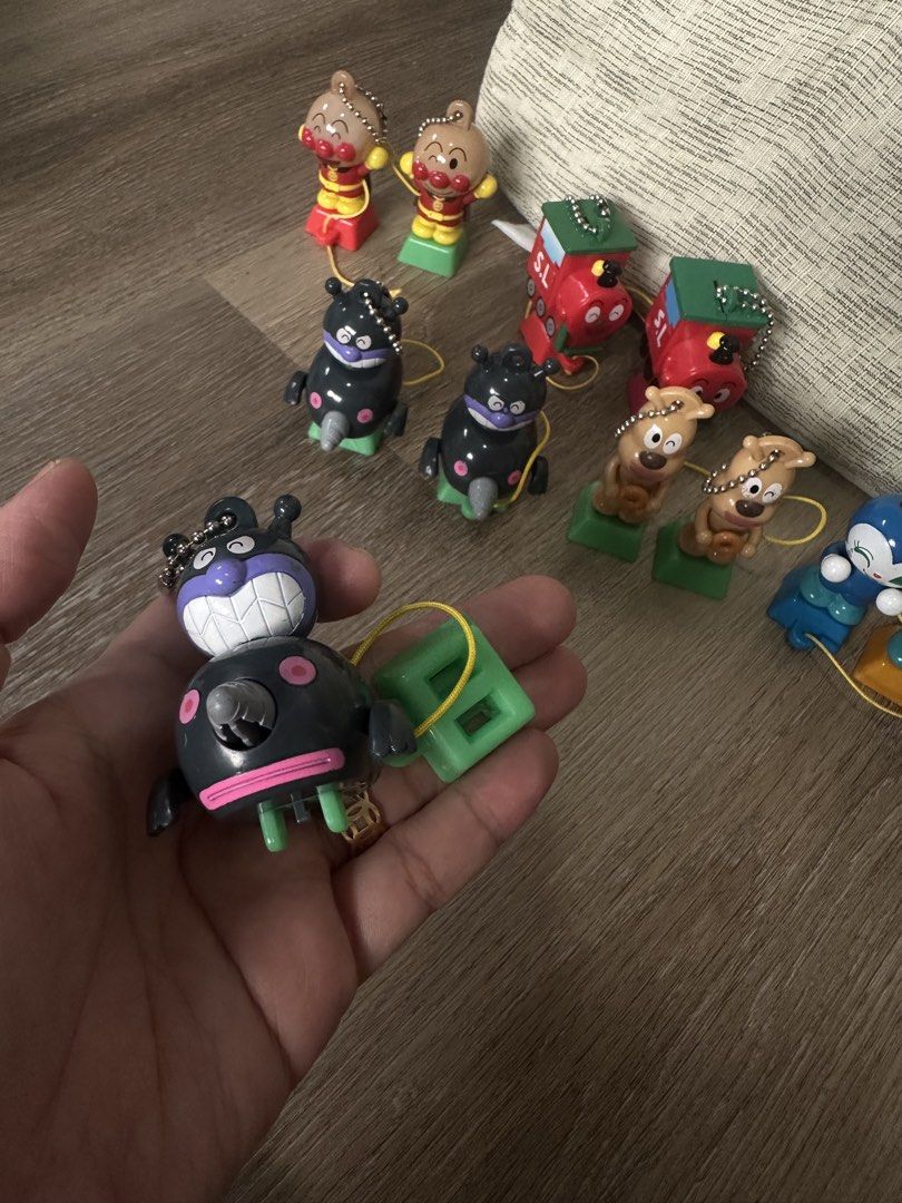 Anpanman Character Figures Train Set Collectible Keychains (Category: Character Goods) located in Cainta. Submitted by shopbyyna (Listing ID 1466009054, Image 2). Description: - Complete your collection with this rare set of vintage Anpanman characters and train cars - Includes favorite characters like Baikinman, cheese dog, SL train engine, and blue characters - Each figure features a sturdy colored base with an attached string loop and ball cha