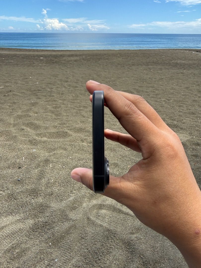 Apple iPhone 16 Black (Category: iPhone 16 Series) located in Llorente. Submitted by anthondoble (Listing ID 1465997623, Image 3). Description: Selling a sleek Black iPhone 16 in pristine condition. Features a clean matte finish, dual cameras, physical side buttons, and a USB-C port. Comes with the original white retail box. Perfect upgrade, ready to use! Complete with orig box and charing cord.