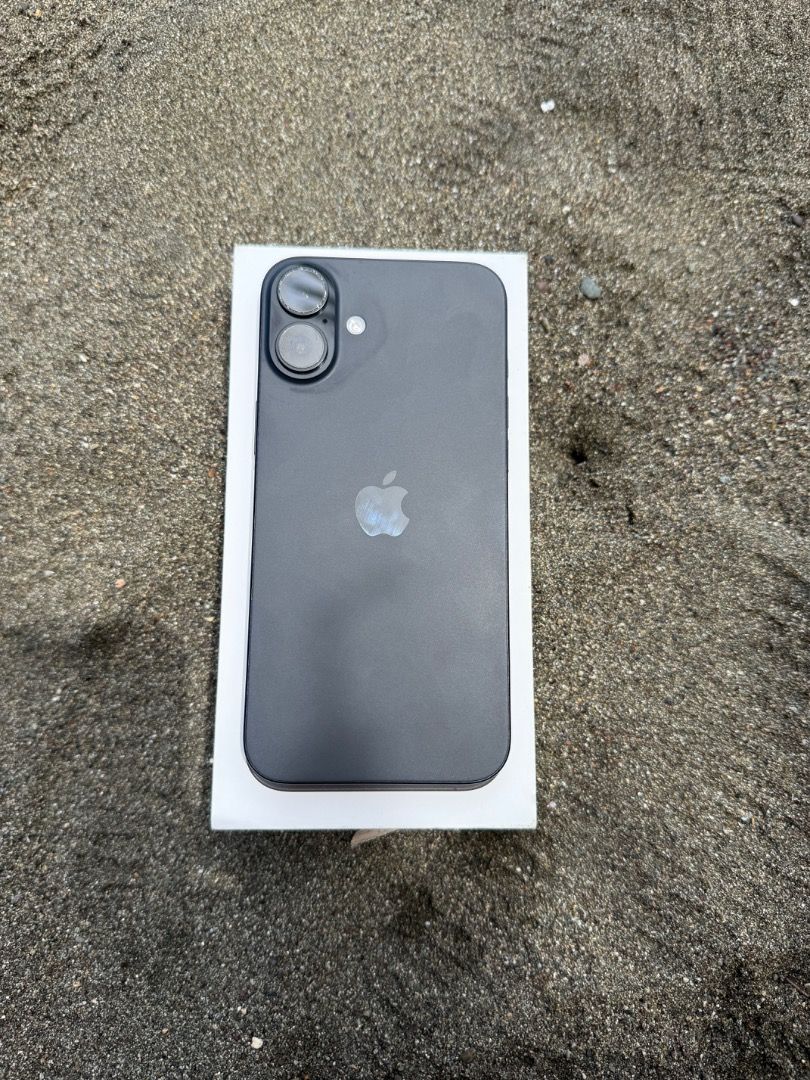 Apple iPhone 16 Black (Category: iPhone 16 Series) located in Llorente. Submitted by anthondoble (Listing ID 1465997623, Image 1). Description: Selling a sleek Black iPhone 16 in pristine condition. Features a clean matte finish, dual cameras, physical side buttons, and a USB-C port. Comes with the original white retail box. Perfect upgrade, ready to use! Complete with orig box and charing cord.