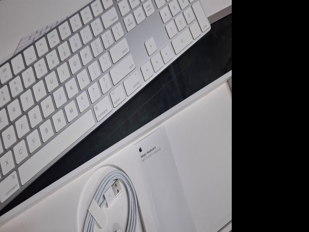 Apple Magic Keyboard with Numeric Keypad (Category: Computer Keyboard) located in Taguig. Submitted by hanniedew (Listing ID 1466104210, Image 3). Description: - Authentic Apple Magic Keyboard with Numeric Keypad (Silver) - Standard QWERTY layout with full arrow keys and numeric pad - Sleek white keys with a durable aluminum frame - Comes complete with original box, Lightning to USB cable, and documentation - Plug-and-play ready and in excellent,