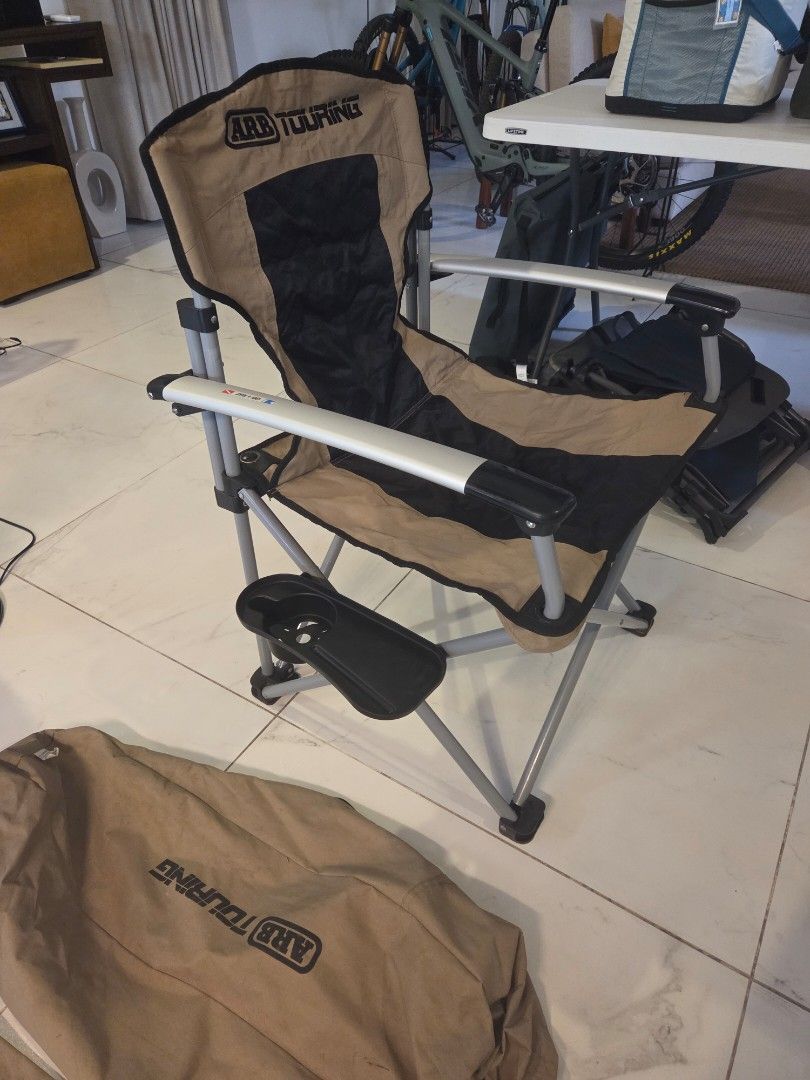 ARB Touring Camping Chair with Table (Category: Hiking & Camping) located in Makati City. Submitted by kanixa (Listing ID 1465993603, Image 3). Description: Upgrade your outdoor setup with the premium ARB Touring Camping Chair and Table set! - Authentic ARB gear with matching carry bag (Part No. 10500101A) - Built-in side table for your drinks, phone, or snacks - Heavy-duty, foldable steel frame for maximum durability - Stylish and tough tan and 