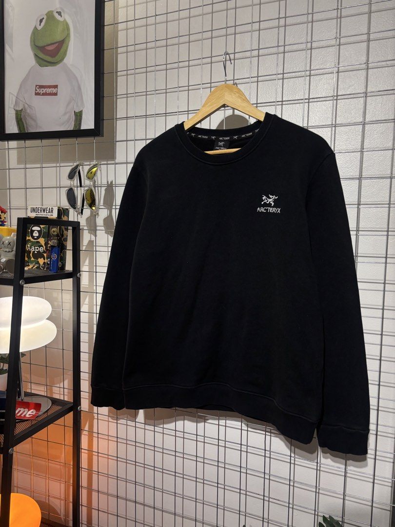 Arc'teryx Black Sweatshirt 2XL (Category: Coats, Jackets and Outerwear) located in Cavite. Submitted by vlblgrmnts_ (Listing ID 1466074627, Image 2). Description: Arcteryx - P-248 21x25 Bestfit Meduim 9/10 CR 800 - Brand: Arc'teryx - Style: Classic crewneck pullover - Size: 2XL (Extra Extra Large) - Color: Black with white embroidered logo on chest - Details: Branded taping around interior collar - Interior: Soft, cozy fleece lining - Condition: 