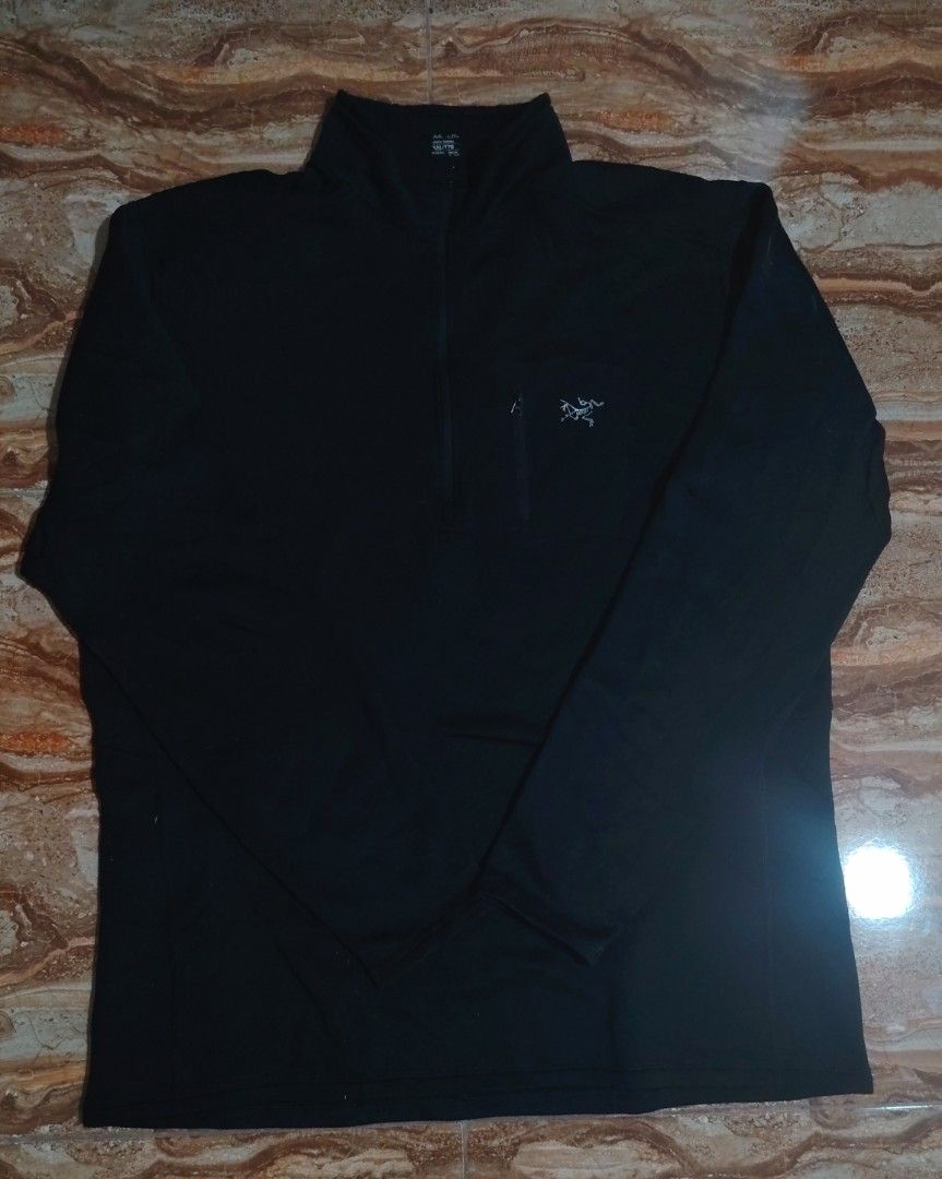 Arc'teryx Rho AR 1/2 Zip Pullover Fleece Jacket XXL (Category: Coats, Jackets and Outerwear) located in Danao, Cebu. Submitted by gossen_delamerced (Listing ID 1466146280, Image 3). Description: - Brand: Arc'teryx - Type: Half-zip fleece pullover - Color: Solid black - Size: XXL - Features: Mock neck, quarter-zip front, and zippered left chest pocket with embroidered fossil logo - Condition: Clean, excellent for outdoor layering.