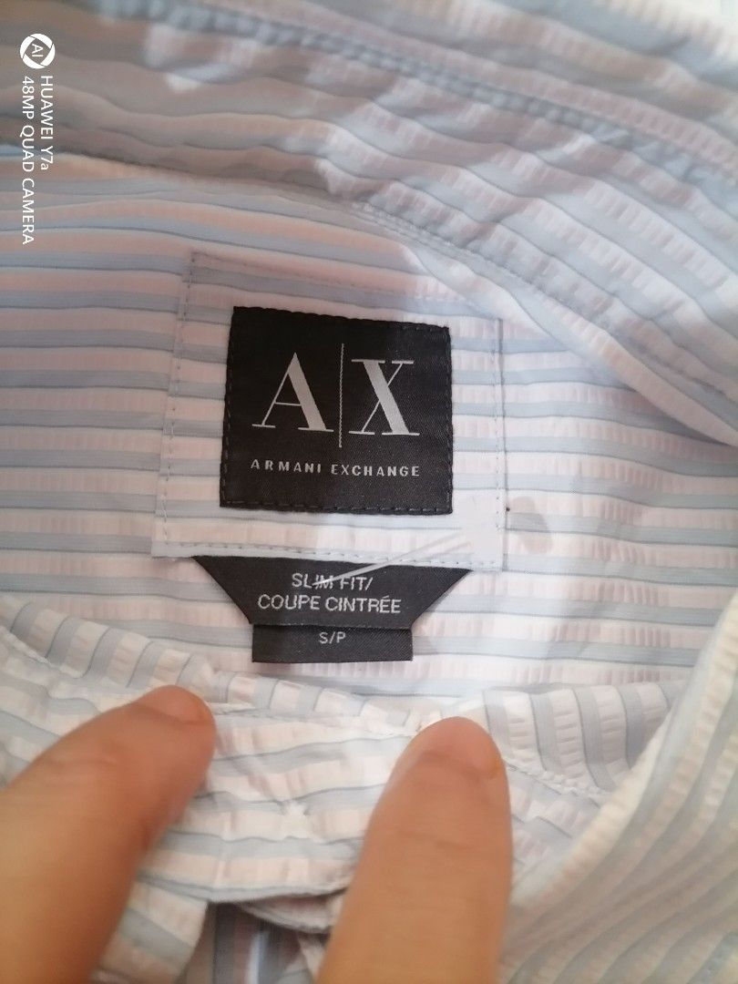 Armani Exchange Slim Fit Striped Button-Down Shirt Size S (Category: Tshirts & Polo Shirts ) located in Naga. Submitted by mrwisethrifter (Listing ID 1465984574, Image 2). Description: - Brand: Armani Exchange - Style: Slim fit long sleeve button-down shirt - Pattern: Blue and white vertical stripes - Size: S/P - Details: Classic collar, branded front and cuff buttons - Condition: Clean fabric throughout, well-maintained.