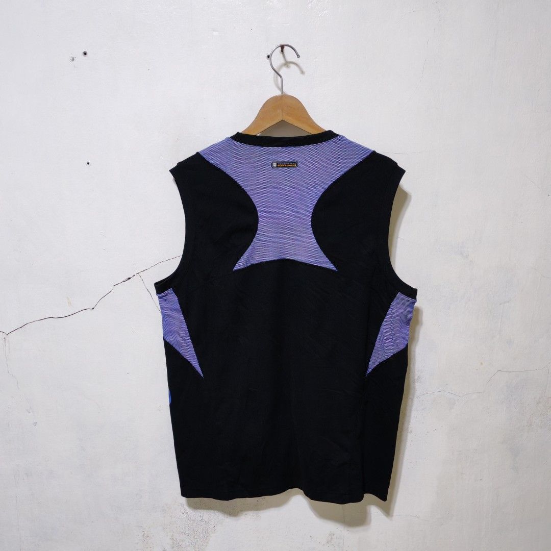Asics Track and Field Black Blue Singlet (Category: Activewear) located in Manila. Submitted by ryandip88861707 (Listing ID 1465957455, Image 3). Description: - Authentic Asics track and field tank top in black and blue - Breathable purple patterned mesh panels on shoulders and back yoke for ventilation - Large vertical Asics logo on the bottom left hem and 'Track & Field' text on the front right chest - Lightweight, high-performance athletic mat