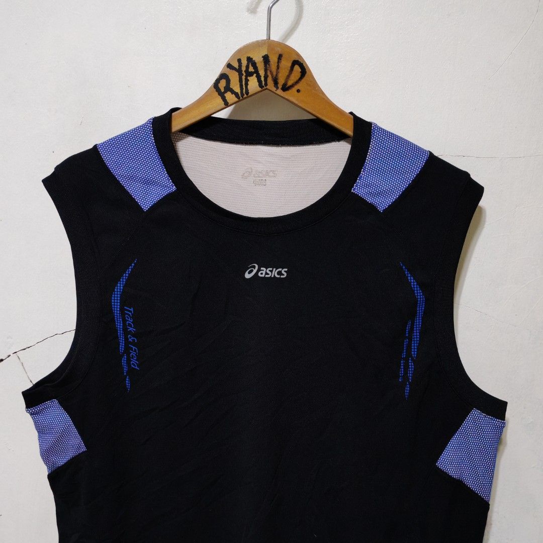 Asics Track and Field Black Blue Singlet (Category: Activewear) located in Manila. Submitted by ryandip88861707 (Listing ID 1465957455, Image 2). Description: - Authentic Asics track and field tank top in black and blue - Breathable purple patterned mesh panels on shoulders and back yoke for ventilation - Large vertical Asics logo on the bottom left hem and 'Track & Field' text on the front right chest - Lightweight, high-performance athletic mat