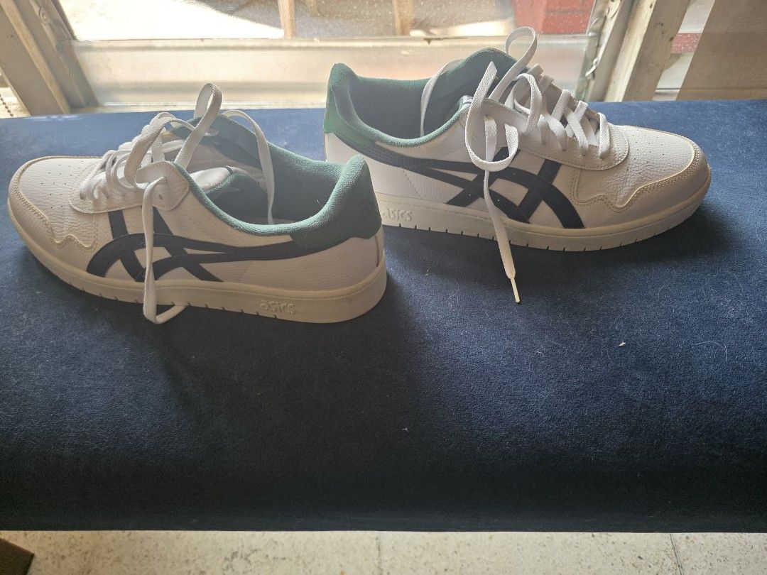ASICS White Green Navy Casual Sneakers (Category: Sneakers) located in Manila. Submitted by merinomigu76662 (Listing ID 1466094030, Image 1). Description: - Brand: ASICS ("12.5) - Style: Low-top classic court sneakers - Colorway: White leather with dark navy stripes and green heel panels - Details: Includes white laces and textured rubber outsoles - Condition: Clean uppers with minimal wear on the treads - Perfect for: Great everyday wear.