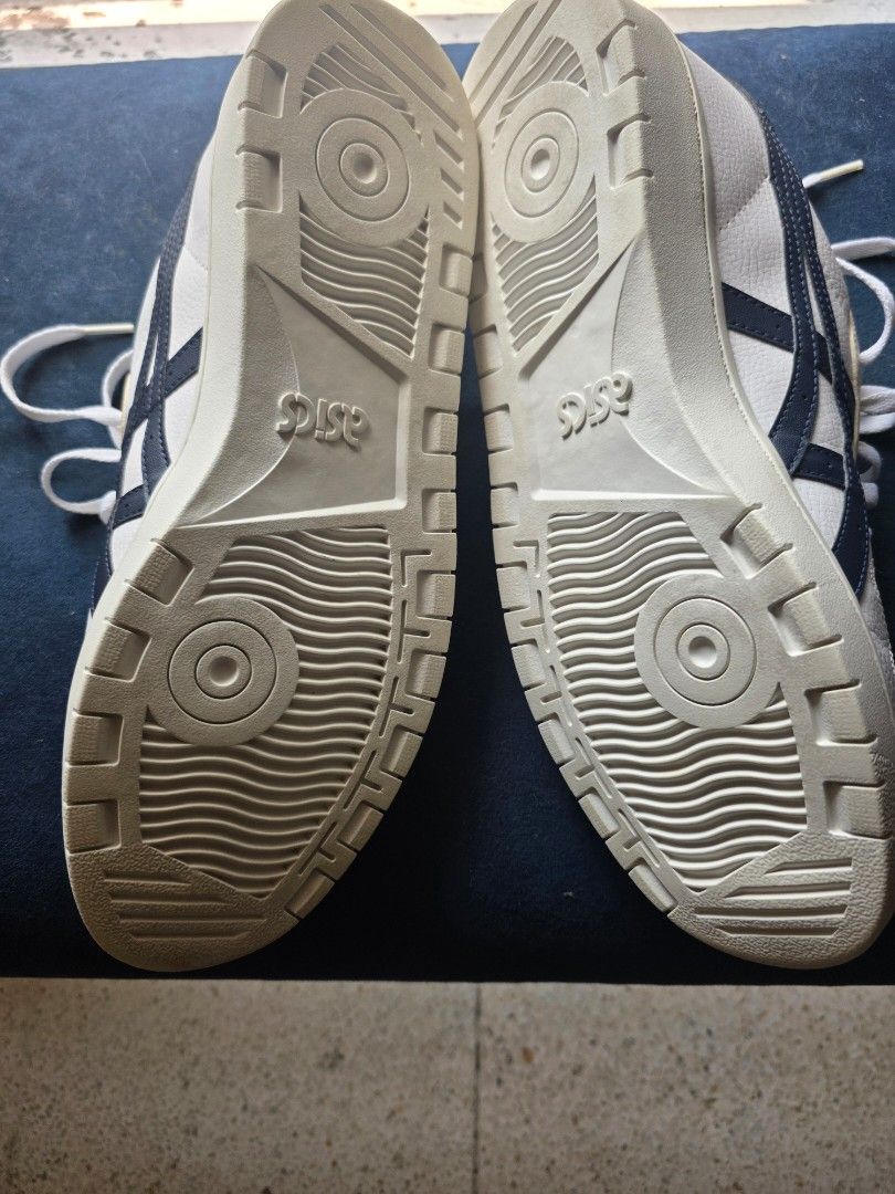 ASICS White Green Navy Casual Sneakers (Category: Sneakers) located in Manila. Submitted by merinomigu76662 (Listing ID 1466094030, Image 3). Description: - Brand: ASICS ("12.5) - Style: Low-top classic court sneakers - Colorway: White leather with dark navy stripes and green heel panels - Details: Includes white laces and textured rubber outsoles - Condition: Clean uppers with minimal wear on the treads - Perfect for: Great everyday wear.
