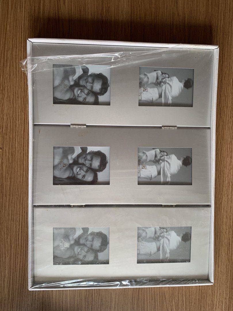 Assorted Photo Frames Bundle Picture Frames Set (Category: Frames & Pictures) located in Singapore. Submitted by highfiv (Listing ID 1465967986, Image 3). Description: Variety of photo frames in different sizes and styles. Includes multi-photo collage frames with 'FAMILY' and 'LOVE' lettering, wooden frames, and tabletop displays. Most frames still have corner protectors and original packaging intact. Great for displaying memories around the hous