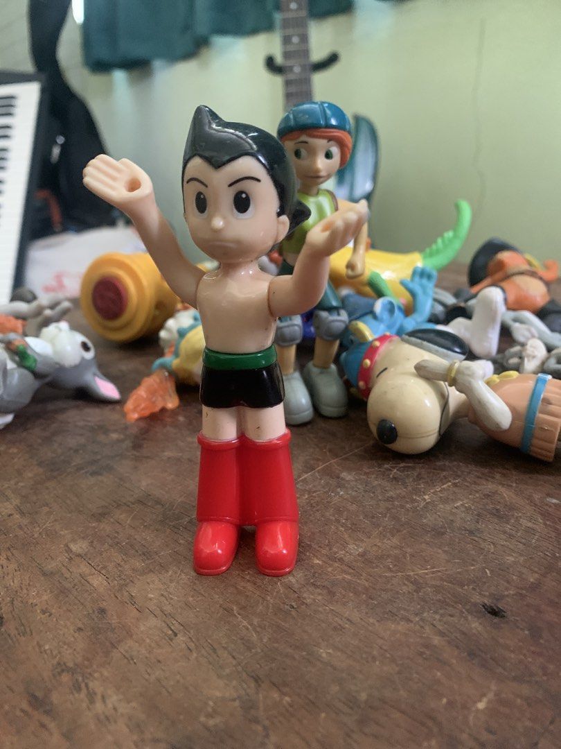 Astro Boy Vintage Action Figure 2009 (Category: Figurines & Statues) located in Makati City. Submitted by emenem.m (Listing ID 1465988875, Image 1). Description: - Classic Astro Boy collectible figure - Features iconic spiky black hair, red boots, and green belt - Arms raised in a signature pose - Has minor paint wear and scuffs from previous play and display - Perfect addition for fans of retro anime merchandise.