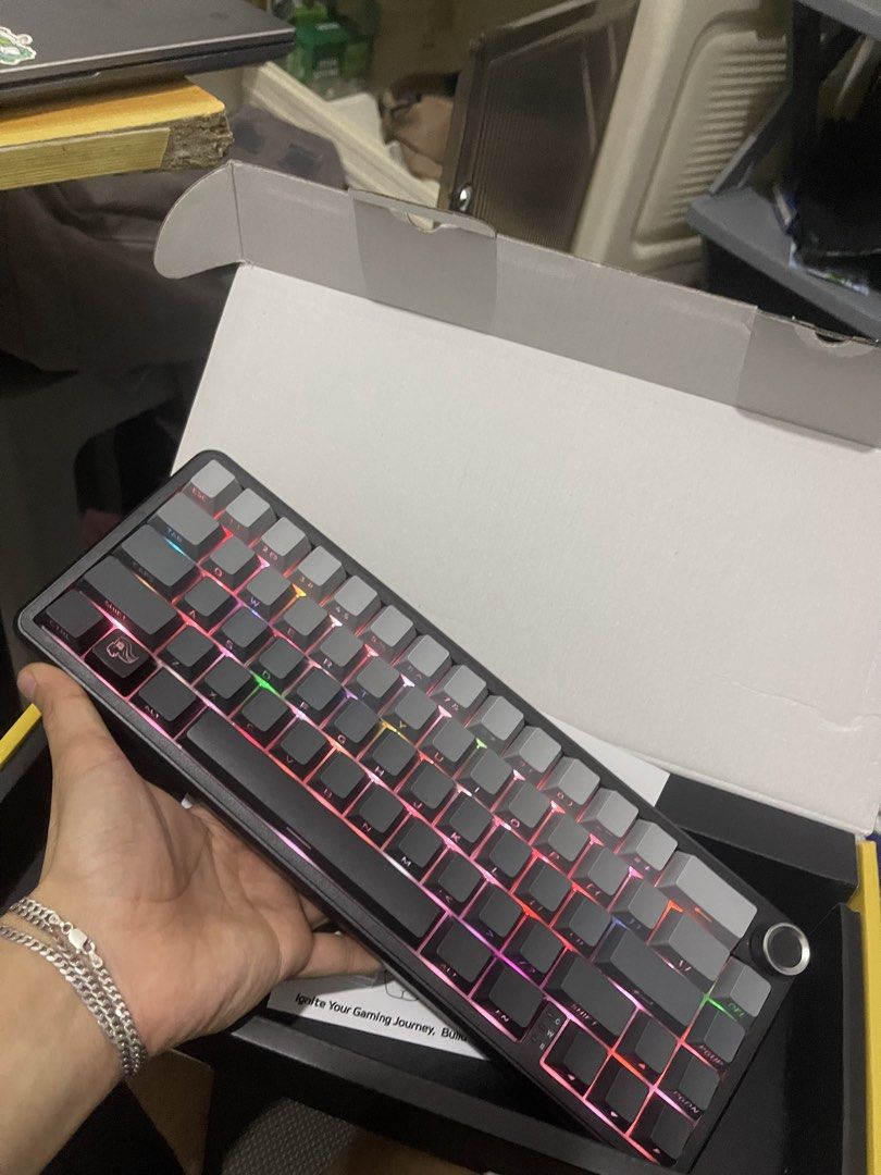 Attack Shark X66 Mechanical Keyboard RGB Tri-Mode (Category: Computer Keyboard) located in Manila. Submitted by gabsy122 (Listing ID 1466116357, Image 1). Description: - Model: Attack Shark X66 Mechanical Keyboard - Colorway: Sleek Black and Grey - Connectivity: Tri-mode (2.4G Wireless, Bluetooth, and Wired) - Layout & Build: 66-key compact layout with a premium gasket structure - Features: Convenient volume knob and vibrant, customizable RGB lig