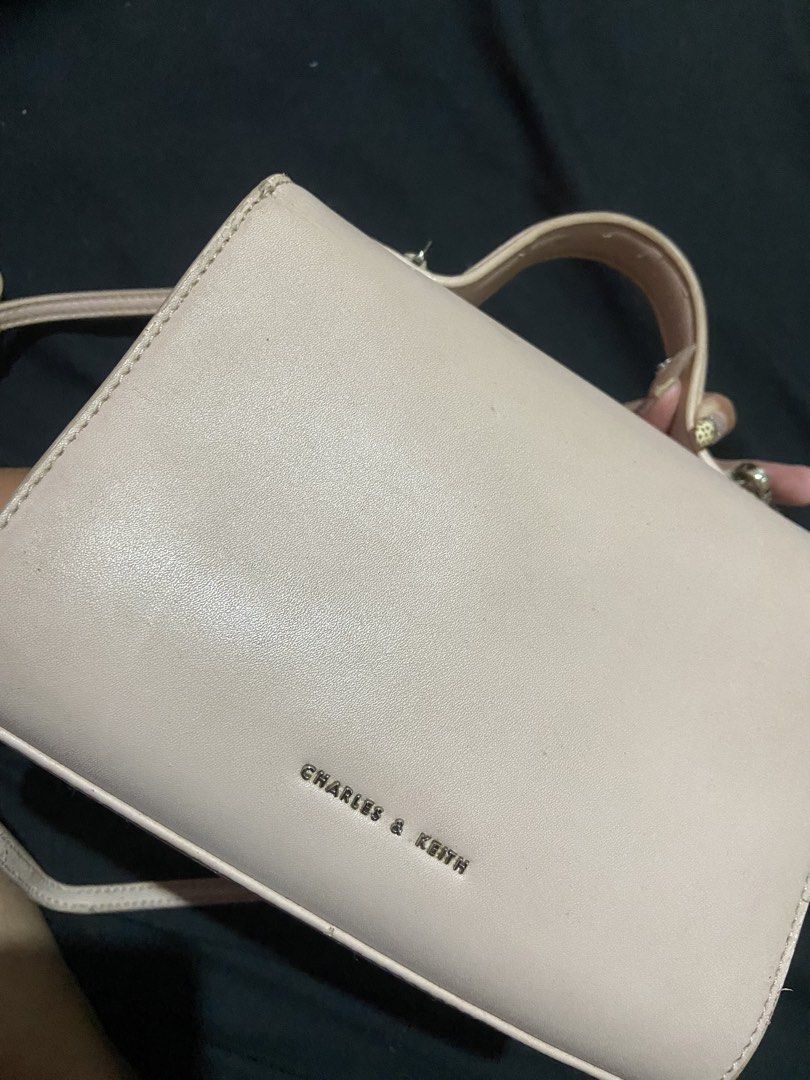 AUTH charles & keith pink sling/shoulder bag (Category: Shoulder Bags) located in Agoo. Submitted by strobeiry (Listing ID 1466124532, Image 2). Description: authentic charles and keith manage your expectations since i’ve used it several times. swipe so u can see the flaws. need cleaning since matagal siya di nagamit. can swap to aztrid medium hobo bag.