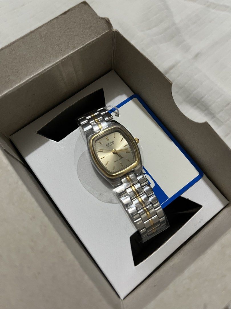 Authentic Casio Quartz Two-Tone Square Dial Watch (Category: Women's Watches) located in Quezon City. Submitted by earthtodior (Listing ID 1466037340, Image 1). Description: - Brand: Casio - Movement: Quartz - Design: Two-tone silver and gold stainless steel bracelet with a gold square dial and minimalist markers - Condition: Brand new, unworn, and still wrapped in original protective plastic - Inclusion: Comes in its original display box - Featu
