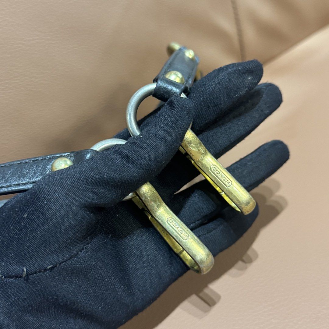 Authentic Coach Black Leather Replacement Bag Strap with Gold and Silver Hardware (Category: Luxury Bags & Wallets) located in Rizal. Submitted by houseofbell (Listing ID 1466151527, Image 2). Description: Authentic Coach leather handbag strap in black. Measures around 25 inches long end to end. Features gold and silver tone hardware with Coach logo engraving on the clasp clips. Solid brass and metal rings linking the leather sections together. G