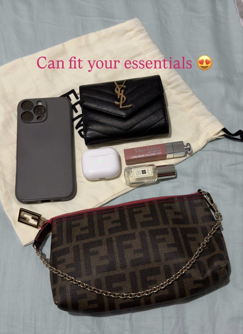 Authentic Fendi Zucca Pochette (Category: Luxury Bags & Wallets) located in Angat. Submitted by shopmyclosetbykris (Listing ID 1466075924, Image 3). Description: Very hard to find Authentic Fendi Zucca Pochette With pink detail, shiny gold hardware Condition: Good as new Comes with dustbag Retails at 76k plus Selling for only 39k LP Posted! Location: Baliwag Bulacan Can do meet ups within Bulacan or QC.