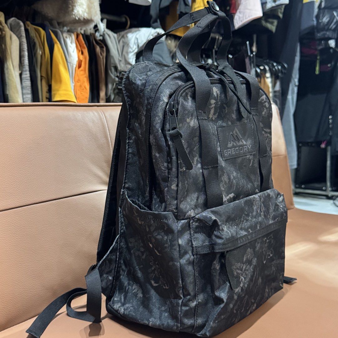 Authentic Gregory Black Floral Pattern Backpack (Category: Backpacks) located in Rizal. Submitted by houseofbell (Listing ID 1466148651, Image 2). Description: - Brand: Gregory - Design: Stylish dark floral pattern with durable black webbing details - Carry Options: Dual top carry handles and adjustable shoulder straps - Storage: Main compartment with internal slip pocket, front zipped pocket, and side slip pockets - Interior: Clean dark interior