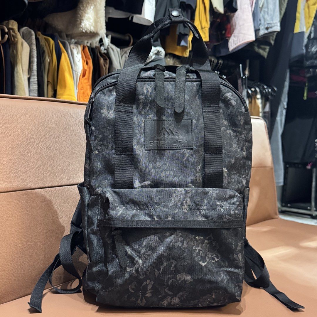 Authentic Gregory Black Floral Pattern Backpack (Category: Backpacks) located in Rizal. Submitted by houseofbell (Listing ID 1466148651, Image 1). Description: - Brand: Gregory - Design: Stylish dark floral pattern with durable black webbing details - Carry Options: Dual top carry handles and adjustable shoulder straps - Storage: Main compartment with internal slip pocket, front zipped pocket, and side slip pockets - Interior: Clean dark interior