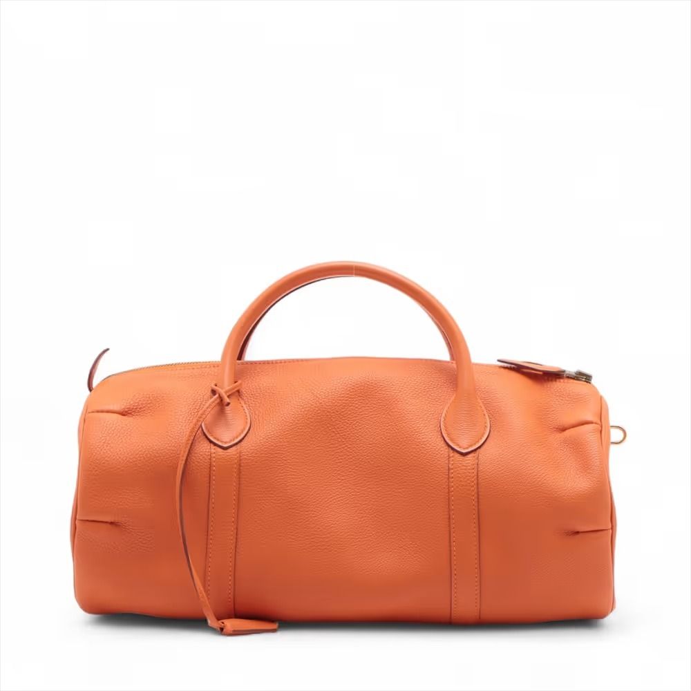 Authentic Hermes Twenty Togo Orange Gold Hardware □E:2001 (Category: Shoulder Bags) located in General Trias. Submitted by japan_secondhand_products (Listing ID 1466076809, Image 2). Description: This item has some minor stains and scratches that are not very noticeable. There is a problem with the padlock lock. It is slightly out of shape and has a storage odor inside. *As this is a used item, there may be scratches or stains not mentioned in th
