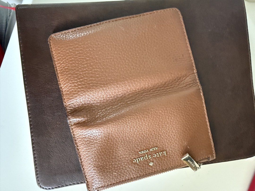 Authentic Kate Spade Bifold Wallet (Category: Wallets & Card holders) located in Marikina City. Submitted by plnkrs (Listing ID 1465990347, Image 3). Description: - Brand: Kate Spade New York - Material: Premium tan pebbled leather - Hardware: Elegant gold-tone with front logo lettering - Exterior: Convenient zip coin pocket - Interior: Multiple card slots, ID window, and signature spade print lining - Closure: Secure snap button closure.