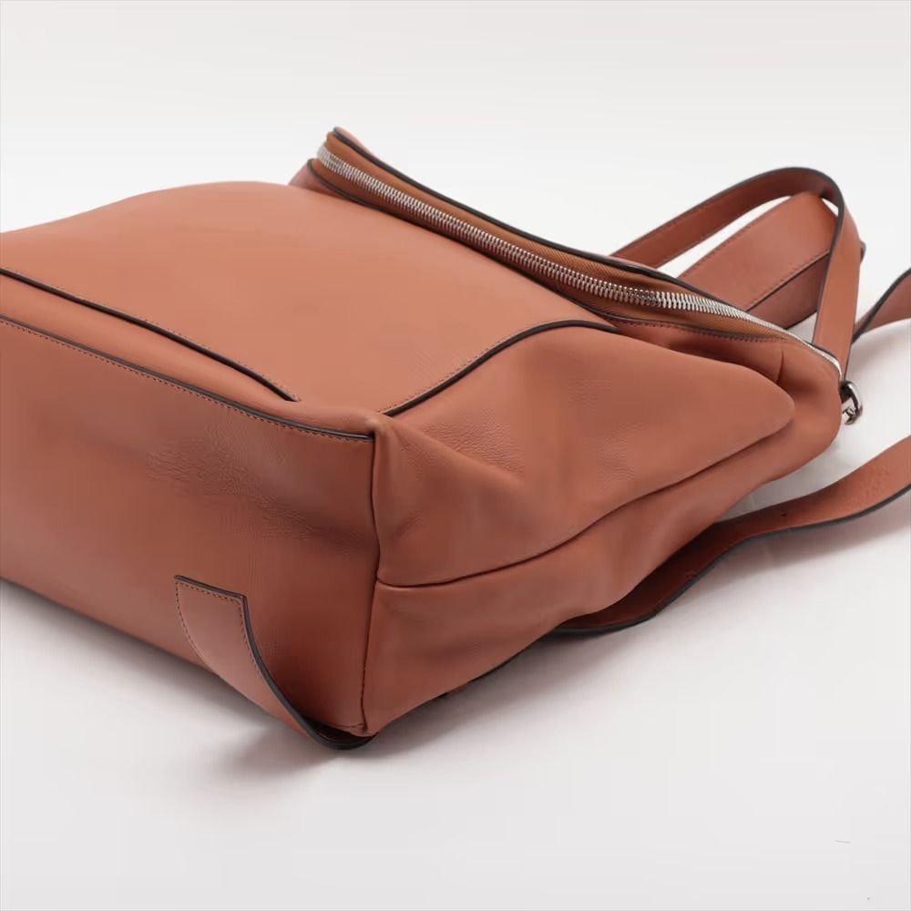 Authentic Loewe Goya Leather Backpack/Rucksack Brown (Category: Backpacks) located in General Trias. Submitted by japan_secondhand_products (Listing ID 1466051289, Image 3). Description: This item shows signs of wear and tear from use. It is out of shape, has cracks on the edges, and peeling on the corners. *Please note that as this is a used item, there may be other scratches or stains not mentioned in the description. Product Rank B brand Loewe