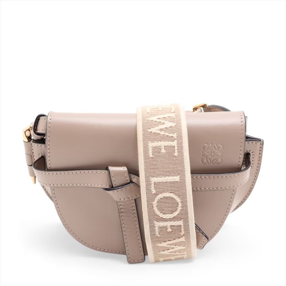 Authentic Loewe Mini Gate Bag Leather Shoulder Bag Beige (Category: Shoulder Bags) located in General Trias. Submitted by japan_secondhand_products (Listing ID 1466047597, Image 1). Description: This item has some inconspicuous stains and minor scratches. There are cracks on the edges. *As this is a used item, there may be scratches or stains not mentioned in the description. Please understand this in advance. Product Rank AB brand Loewe Model Mi