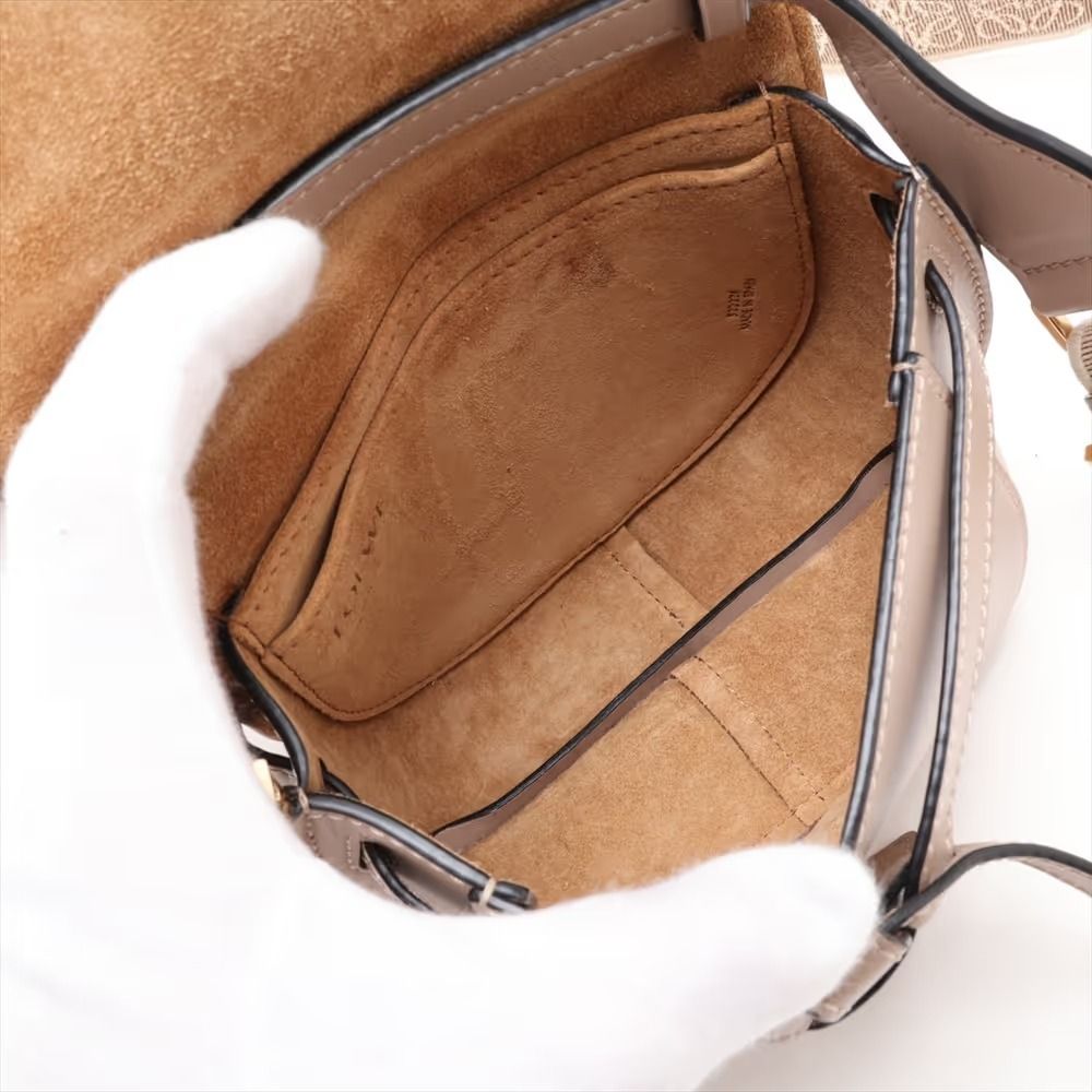 Authentic Loewe Mini Gate Bag Leather Shoulder Bag Beige (Category: Shoulder Bags) located in General Trias. Submitted by japan_secondhand_products (Listing ID 1466047597, Image 3). Description: This item has some inconspicuous stains and minor scratches. There are cracks on the edges. *As this is a used item, there may be scratches or stains not mentioned in the description. Please understand this in advance. Product Rank AB brand Loewe Model Mi