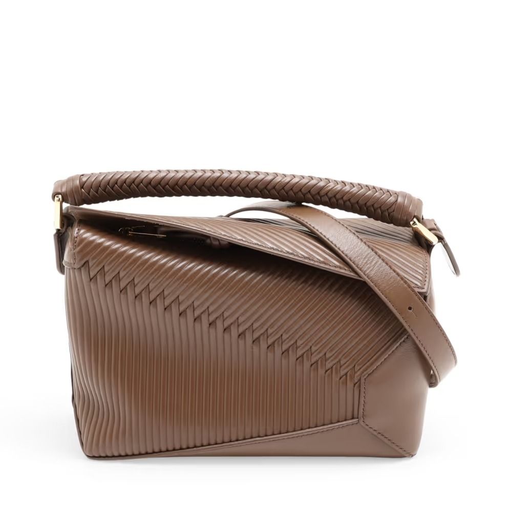 Authentic Loewe Puzzle Edge Small Leather 2-Way Handbag, Brown (Category: Shoulder Bags) located in General Trias. Submitted by japan_secondhand_products (Listing ID 1466050812, Image 1). Description: This item has some inconspicuous stains and minor scratches. There are cracks on the edges. *As this is a used item, there may be scratches or stains not mentioned in the description. Please understand this in advance. Product Rank AB brand Loewe Mo
