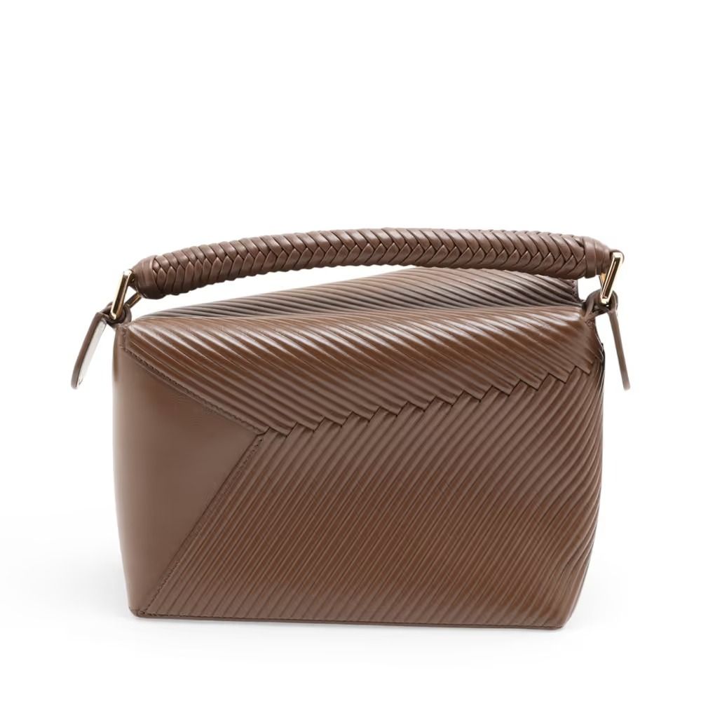 Authentic Loewe Puzzle Edge Small Leather 2-Way Handbag, Brown (Category: Shoulder Bags) located in General Trias. Submitted by japan_secondhand_products (Listing ID 1466050812, Image 2). Description: This item has some inconspicuous stains and minor scratches. There are cracks on the edges. *As this is a used item, there may be scratches or stains not mentioned in the description. Please understand this in advance. Product Rank AB brand Loewe Mo