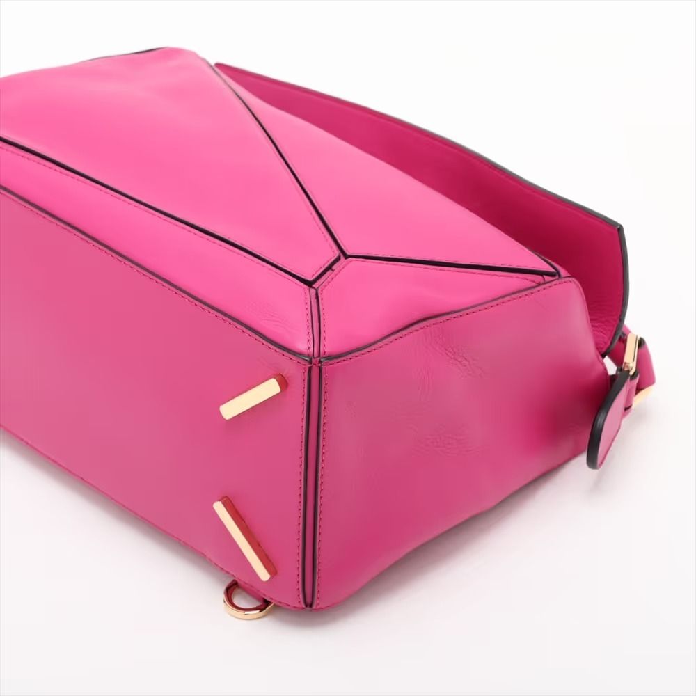 Authentic Loewe Puzzle Medium Leather 2-Way Shoulder Bag, Pink (Category: Shoulder Bags) located in General Trias. Submitted by japan_secondhand_products (Listing ID 1466049262, Image 3). Description: This item has some minor stains and scratches that are not very noticeable. There is a storage odor. *As this is a used item, there may be scratches or stains not mentioned in the description. Please understand this beforehand. Product Rank AB brand