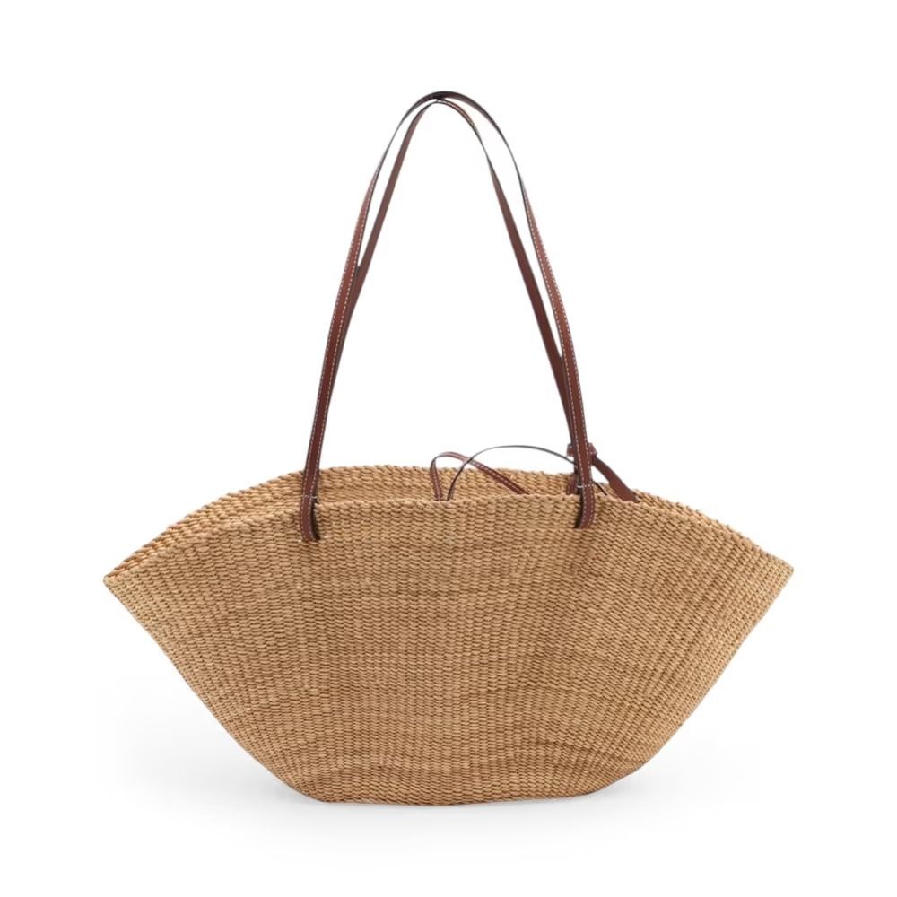 Authentic Loewe Small Shell Basket Raffia Basket Bag Beige (Category: Shoulder Bags) located in General Trias. Submitted by japan_secondhand_products (Listing ID 1466048104, Image 2). Description: This item has some minor stains and scratches that are not very noticeable. There is some peeling on the handle and a "C" mark engraved on the handle. *As this is a used item, there may be scratches or stains not mentioned in the description. Please und