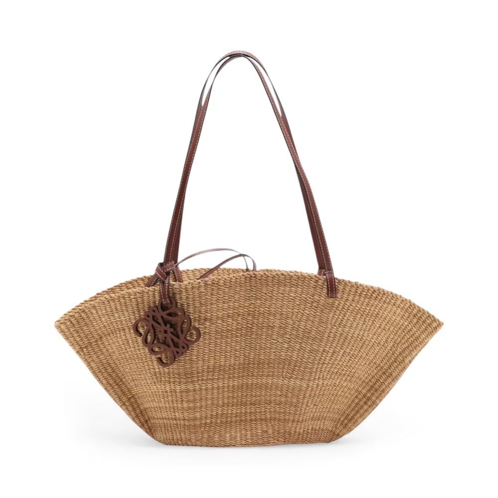 Authentic Loewe Small Shell Basket Raffia Basket Bag Beige (Category: Shoulder Bags) located in General Trias. Submitted by japan_secondhand_products (Listing ID 1466048104, Image 1). Description: This item has some minor stains and scratches that are not very noticeable. There is some peeling on the handle and a "C" mark engraved on the handle. *As this is a used item, there may be scratches or stains not mentioned in the description. Please und