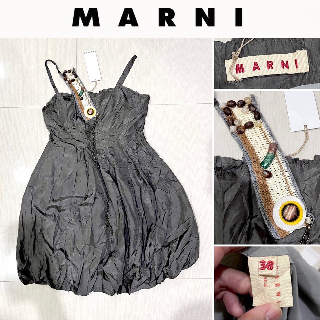 Authentic Marni Silk Beaded Strap Bubble Dress Size 36 (Category: Dresses) located in Amlan (Ayuquitan). Submitted by pringpring (Listing ID 1466128777, Image 2). Description: - Brand: Marni - Color: Dark Grey - Material: Silk - Size: 36 (Store tag attached) - Condition: Brand new, never worn, pristine - Style: Sleeveless bubble hem with spaghetti straps - Special Detail: Unique strap adorned with crochet, wooden beads, stones, and a dangling cha