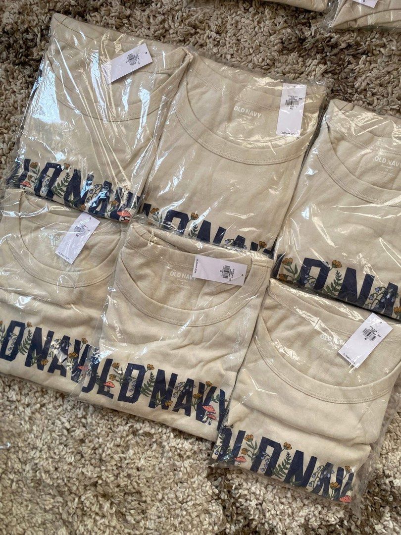 Authentic Old Navy Botanical Graphic T-Shirt (Category: Shirts) located in Batangas. Submitted by lux_kimmy (Listing ID 1466056328, Image 1). Description: - Brand: Old Navy - Color: Cream with blue collegiate floral/mushroom graphic - Material: Soft cotton - Fit: Classic crew neck, short sleeves - Sizes Available: XS, S, M, L, XL, 2XL - Condition: Brand new with store tags in original plastic packaging Bought in US Authentic Old navy 380 each FIX