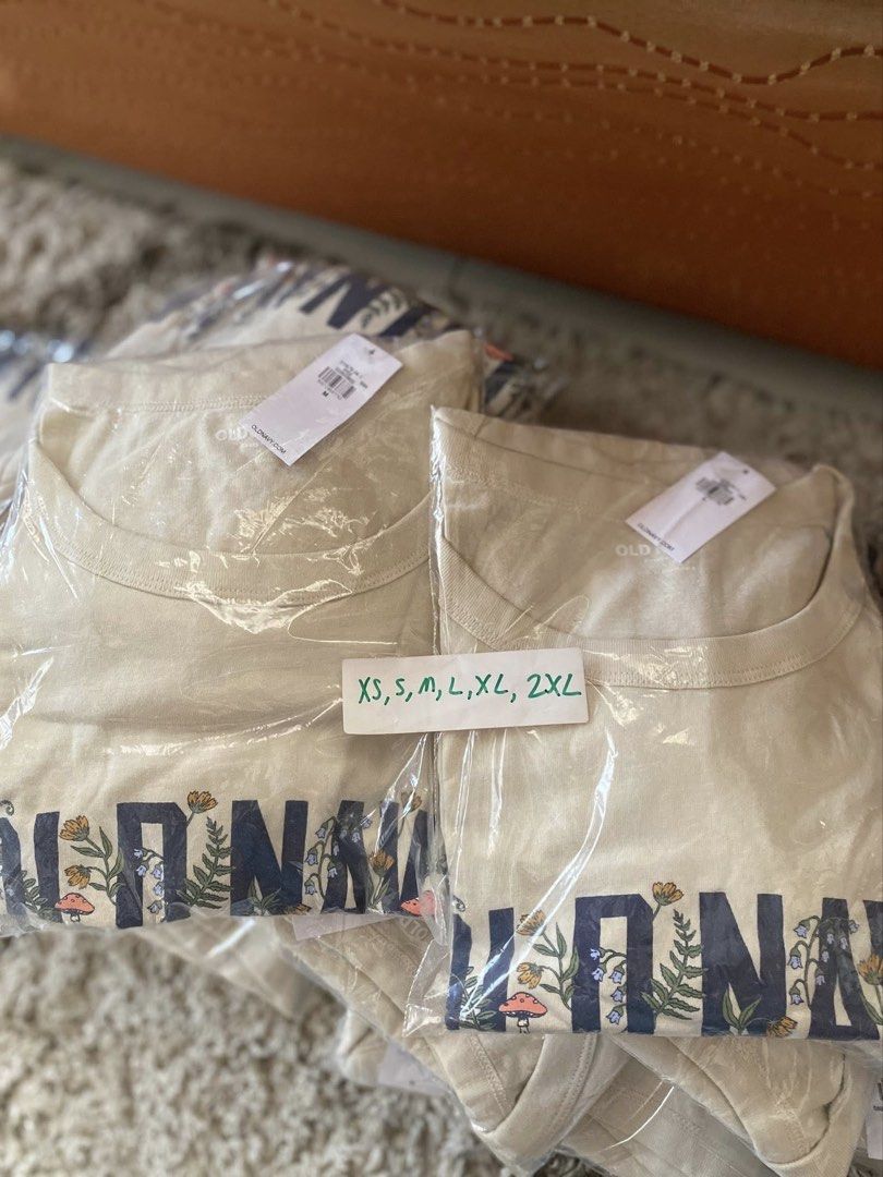 Authentic Old Navy Botanical Graphic T-Shirt (Category: Shirts) located in Batangas. Submitted by lux_kimmy (Listing ID 1466056328, Image 2). Description: - Brand: Old Navy - Color: Cream with blue collegiate floral/mushroom graphic - Material: Soft cotton - Fit: Classic crew neck, short sleeves - Sizes Available: XS, S, M, L, XL, 2XL - Condition: Brand new with store tags in original plastic packaging Bought in US Authentic Old navy 380 each FIX