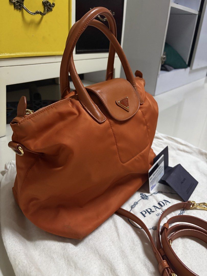 Authentic Prada Tessuto Nylon Handbag bodybag (Category: Luxury Bags & Wallets) located in Antipolo. Submitted by cherrylblossom (Listing ID 1466041448, Image 3). Description: Authentic PRADA Tessuto Nylon Papaya Color With Card and Dustbag .