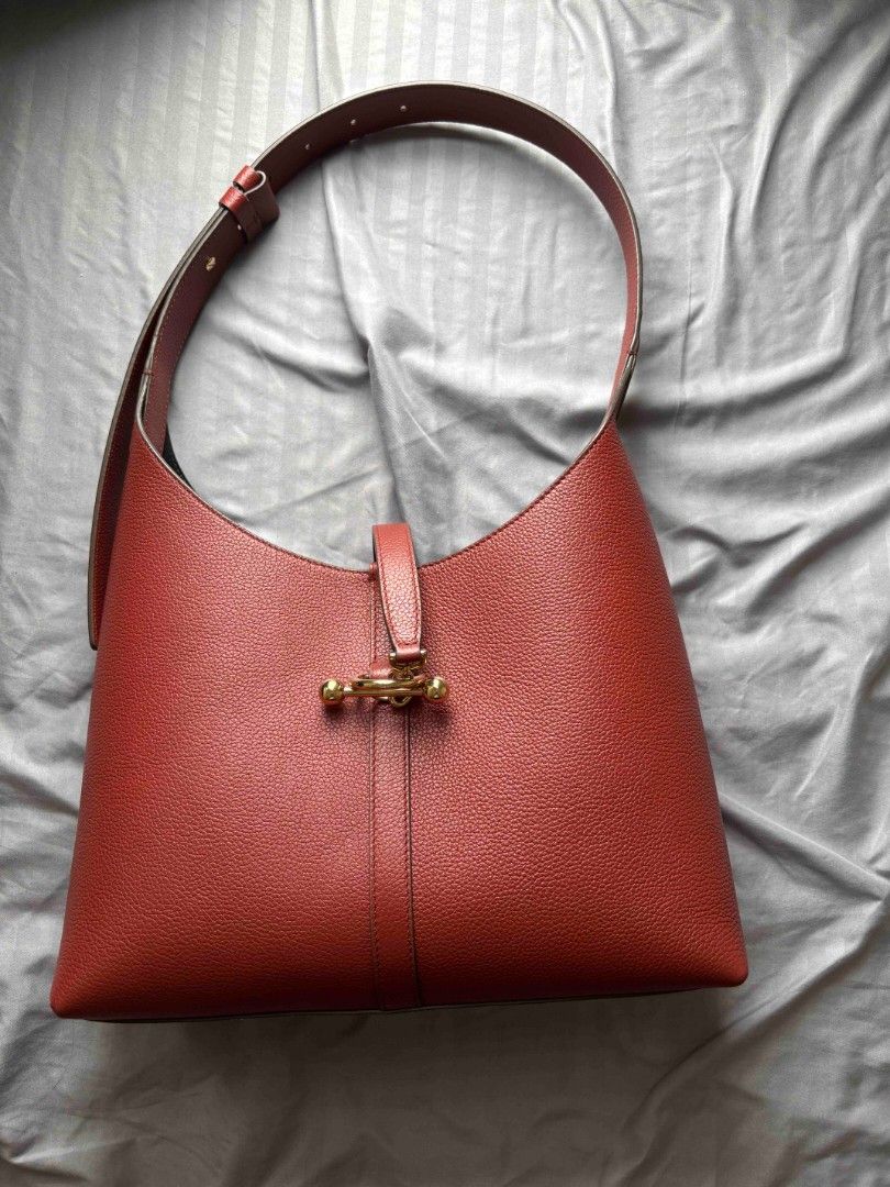 Authentic Strathberry Kite Hobo in Walnut (Category: Luxury Bags & Wallets) located in Pasig City. Submitted by ras0314 (Listing ID 1466089744, Image 2). Description: strathberry Kite Hobo in Walnut (Regular Size) • Condition: Like New • Inclusions: Dust Bag, Box, Care Card • When & where purchased: sourced via pasabuy last Sep.2026 • Retail price: Php45k+ interior's super clean RFS: color not matched with my style :(.