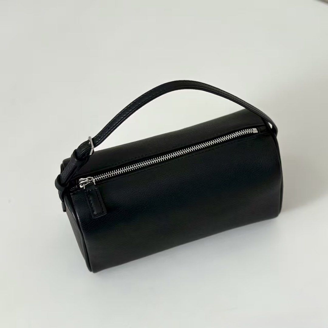 Authentic The Row 90s handbag (Category: Luxury Bags & Wallets) located in Makati City. Submitted by authenticloset (Listing ID 1461052625, Image 3). Description: Authentic - Brand: The Row - Leather: Calfskin - Colour: Black - Includes: Original dust bag.